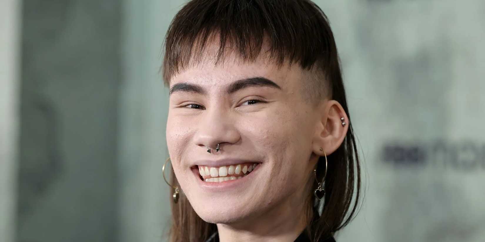 Ian Alexander smiling on the red carpet