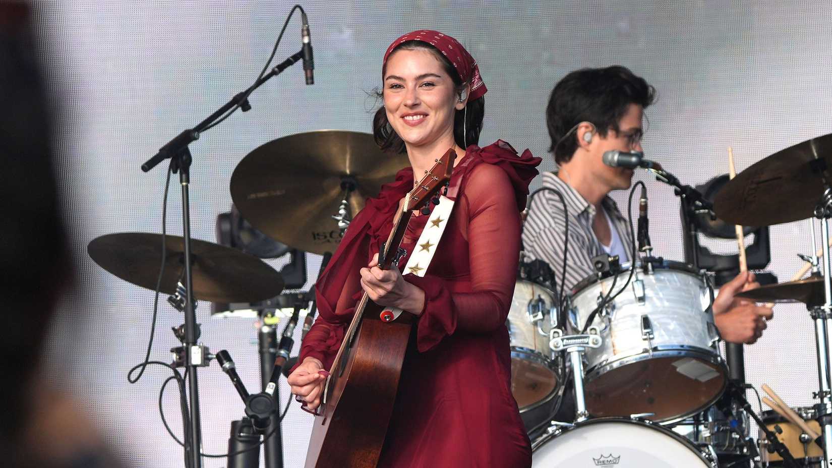 Gracie Abrams playing guitar at the Glastonbury Festival at Worthy Farm in Somerset