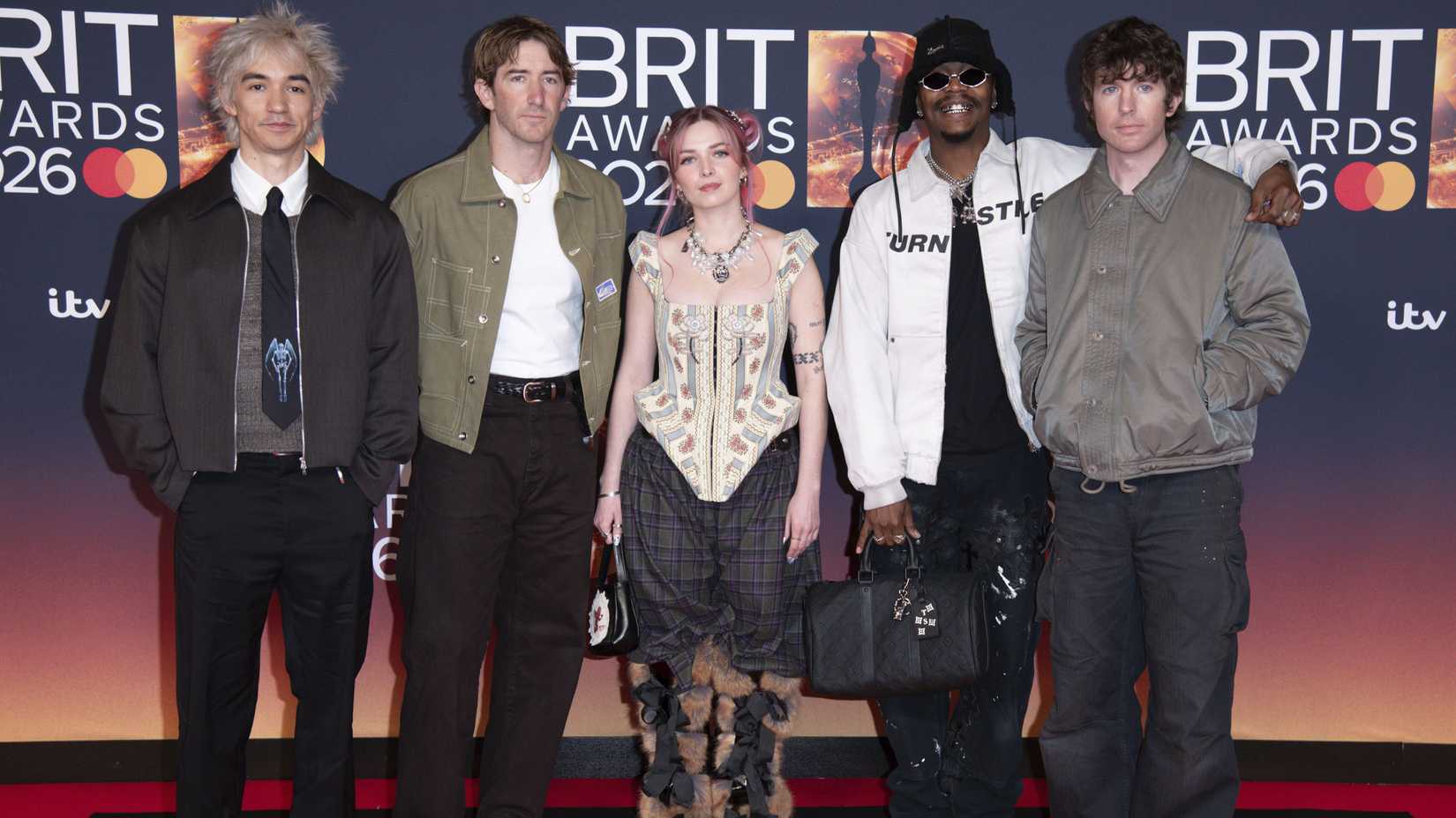 Turnstile posing for a group photo at the Brit Awards 2026 at Co-op Live.