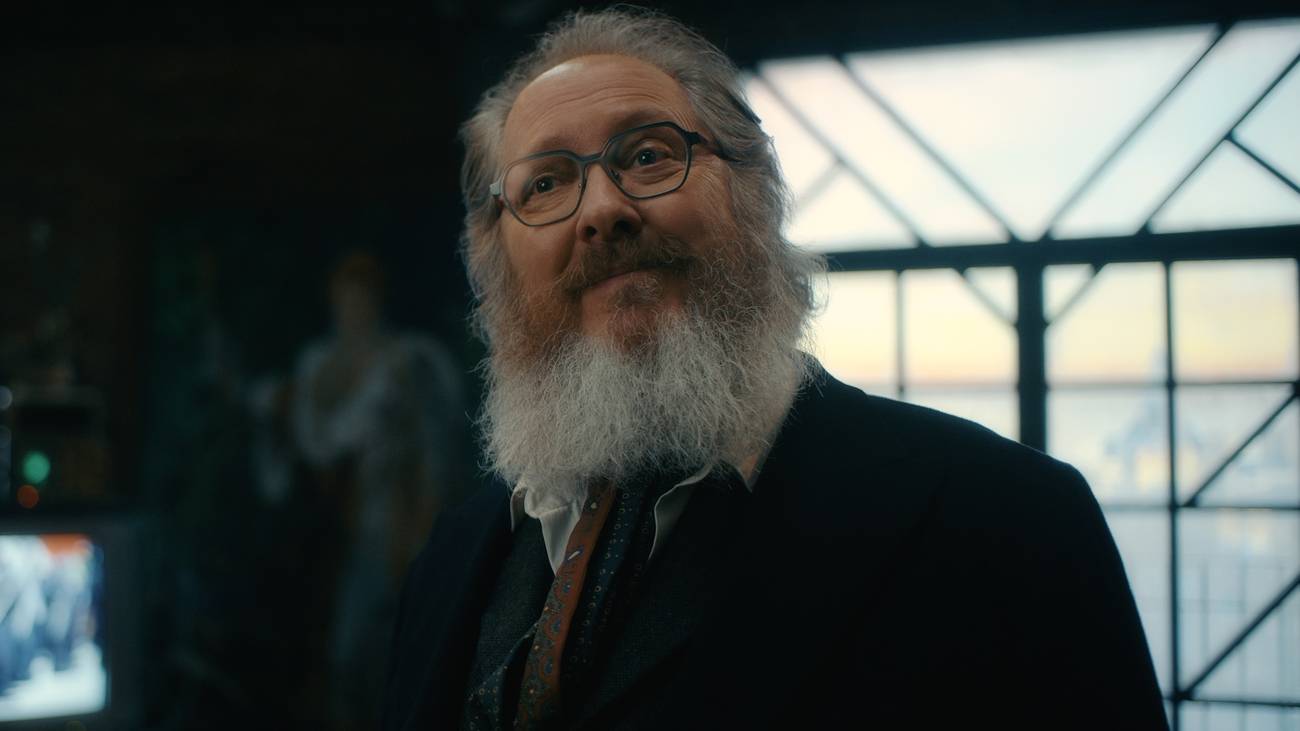 Ultron in his bearded, human form, wearing glasses and a suit