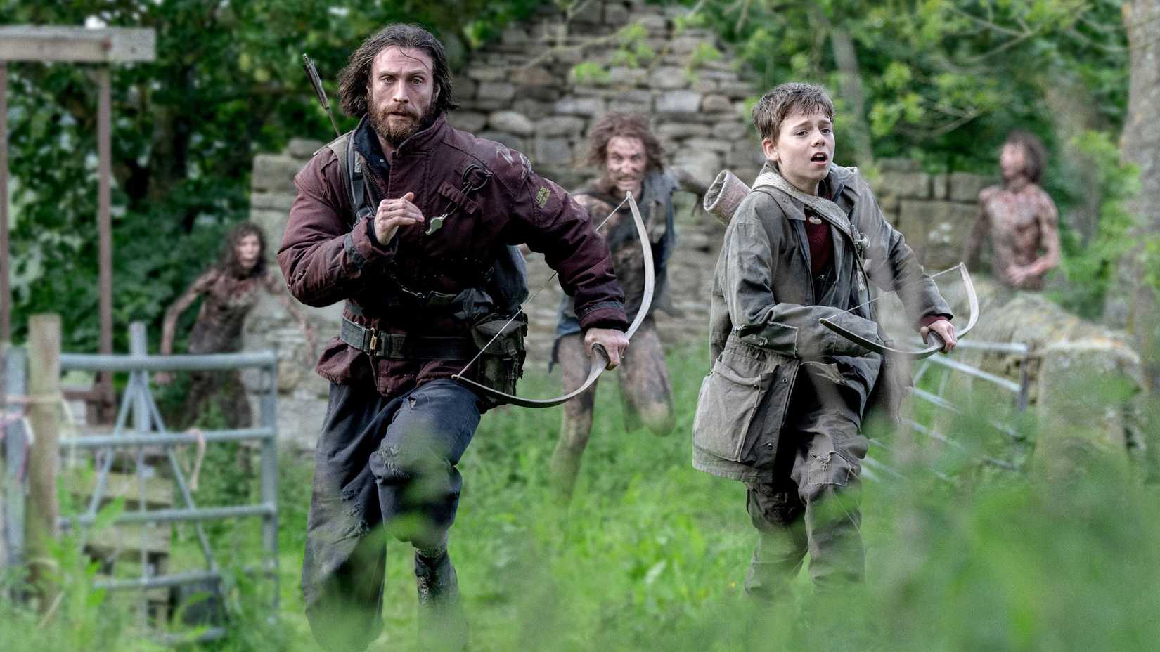 Jamie (Aaron Taylor-Johnson) and Spike (Alfie Williams) running away from infected in 28 Years Later