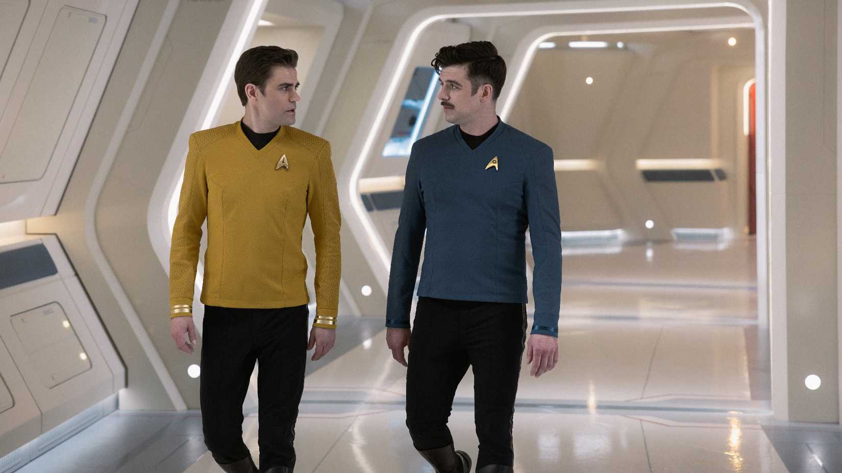 Jim and Sam Kirk walking down Enterprise corridor