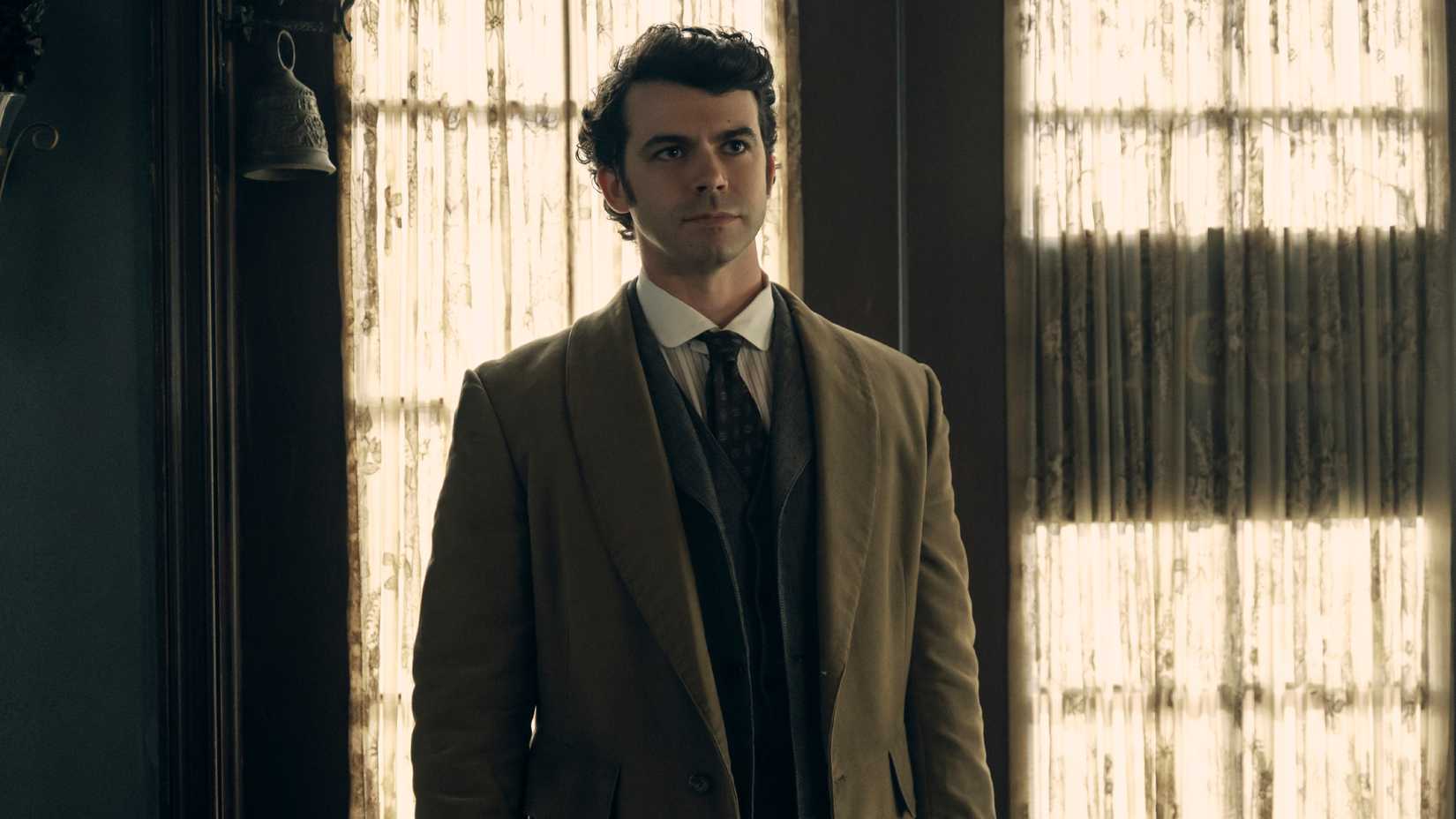 John Morse stands by the door looking upset in episode 3 of Monster: The Lizzie Borden Story