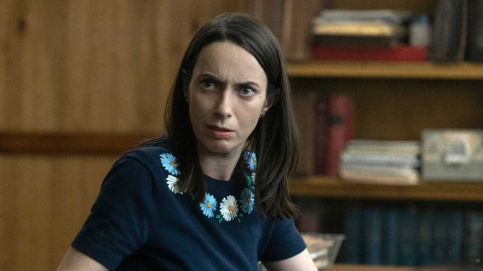 Kate O'Flynn as Patricia turning around in her chair in Widow's Bay season 1