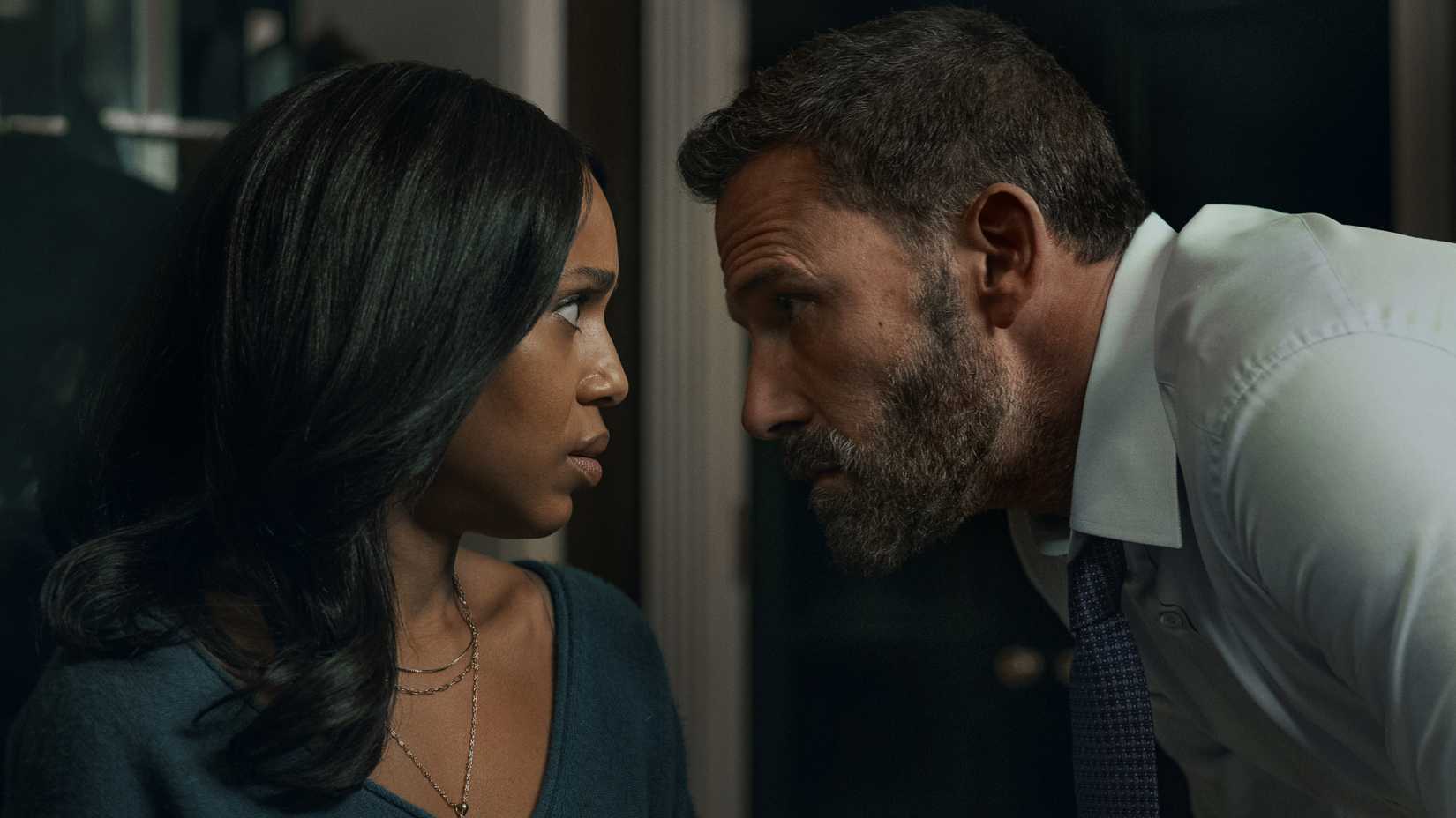 Kerry Washington and Ben Affleck staring at each other in Animals