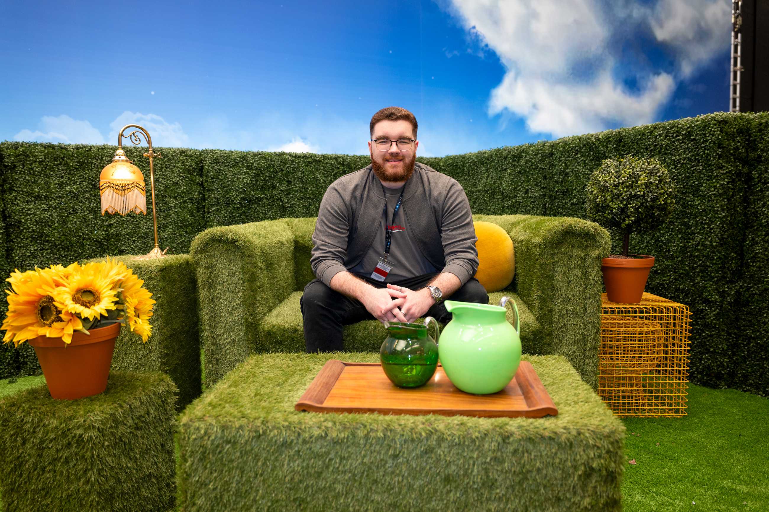 ScreenRant writer, Lewis Glazebrook, sitting on the VisionQuest's Mindscape set