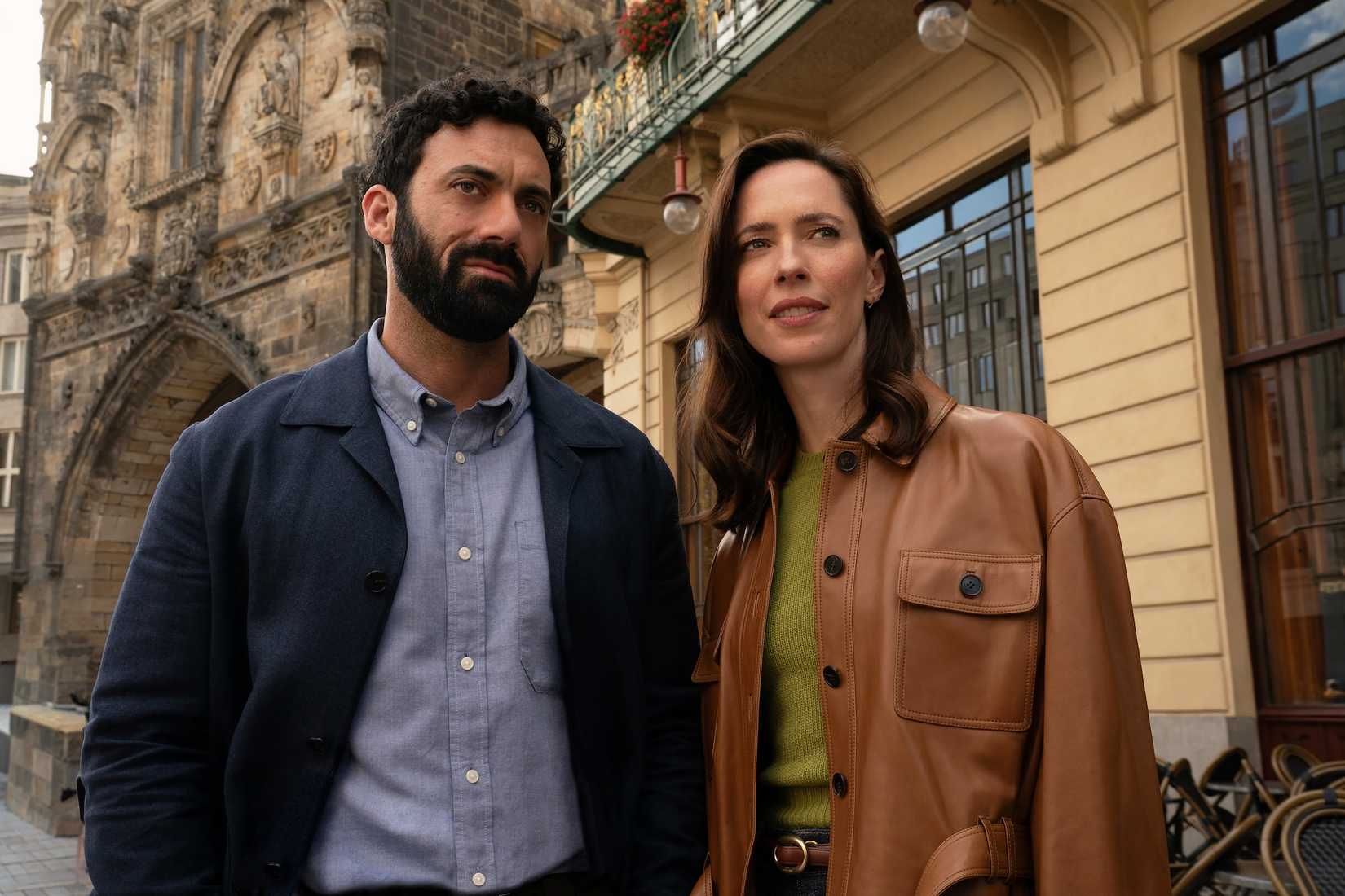 Morgan Spector and Rebecca Hall standing in a Prague street on The Secret of Secrets set