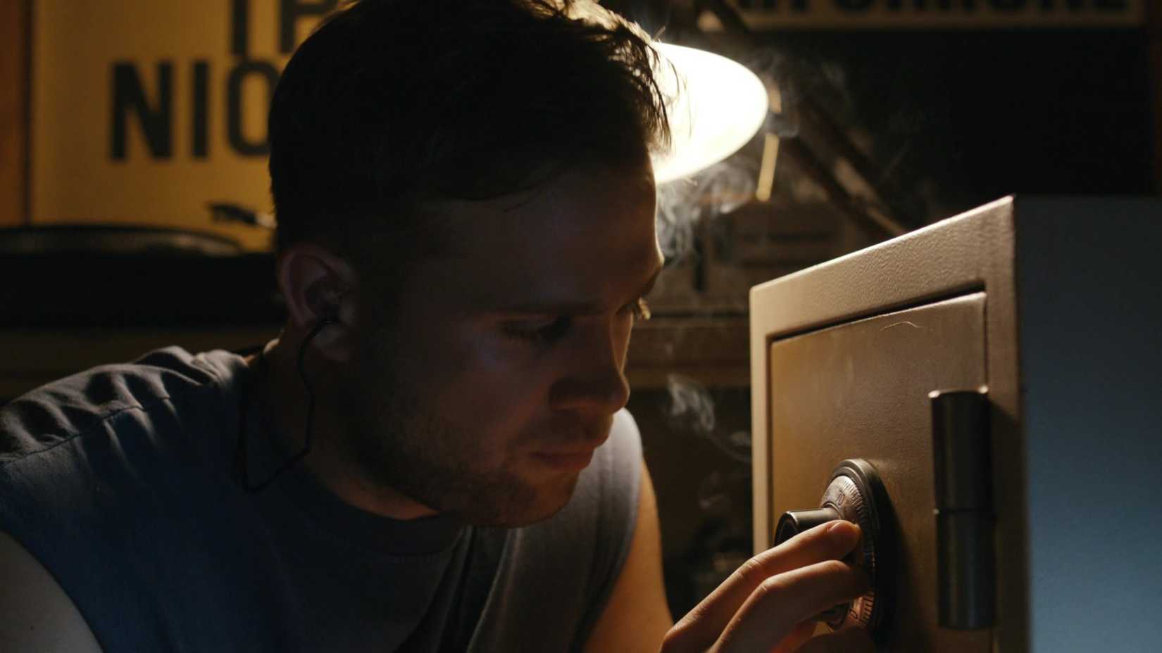 Leo Woodall cracking a safe in Tuner