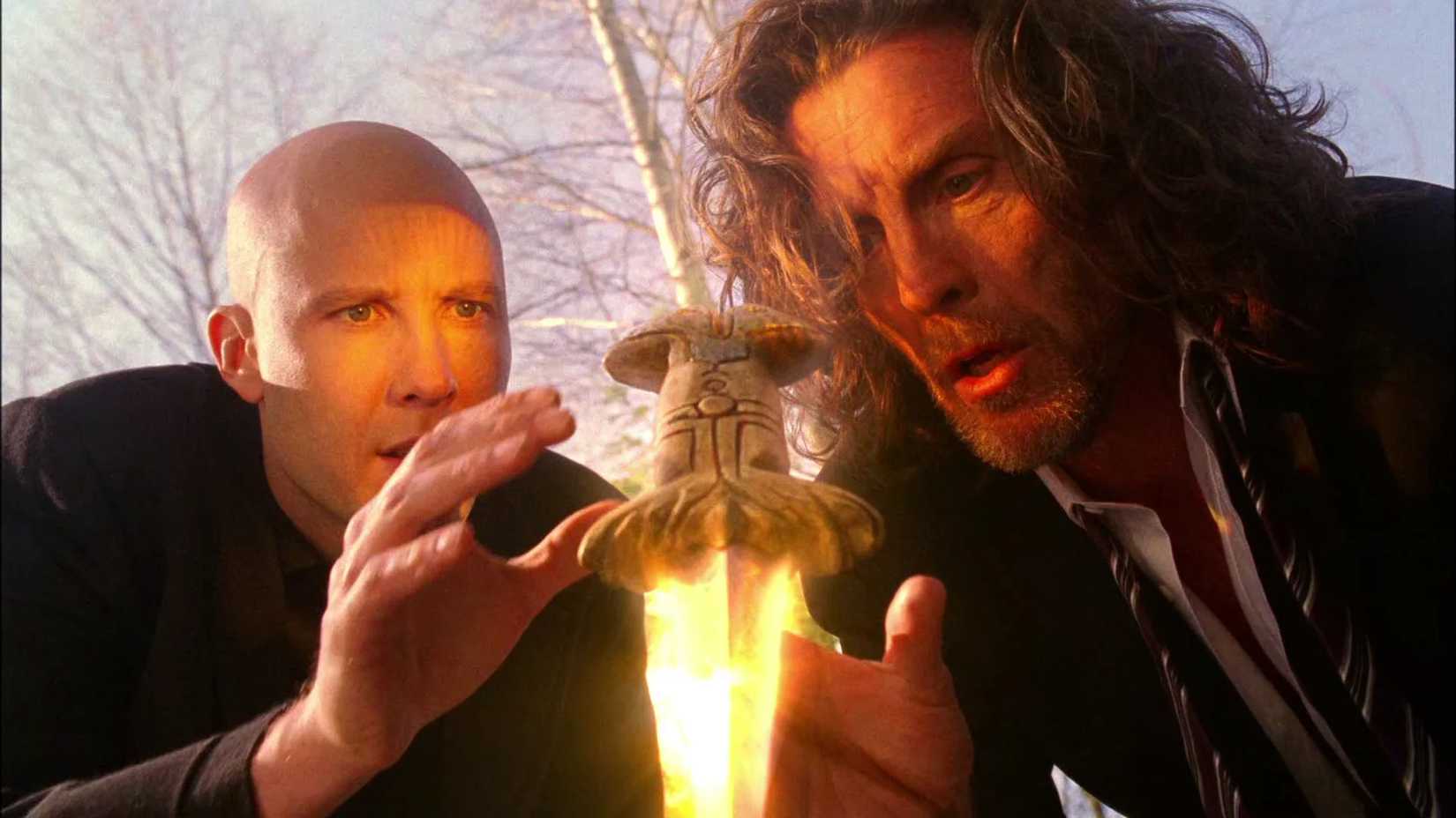 Lex Luthor and Lionel Luthor look at a glowing dagger in Smallville season 3, episode 20, "Talisman"