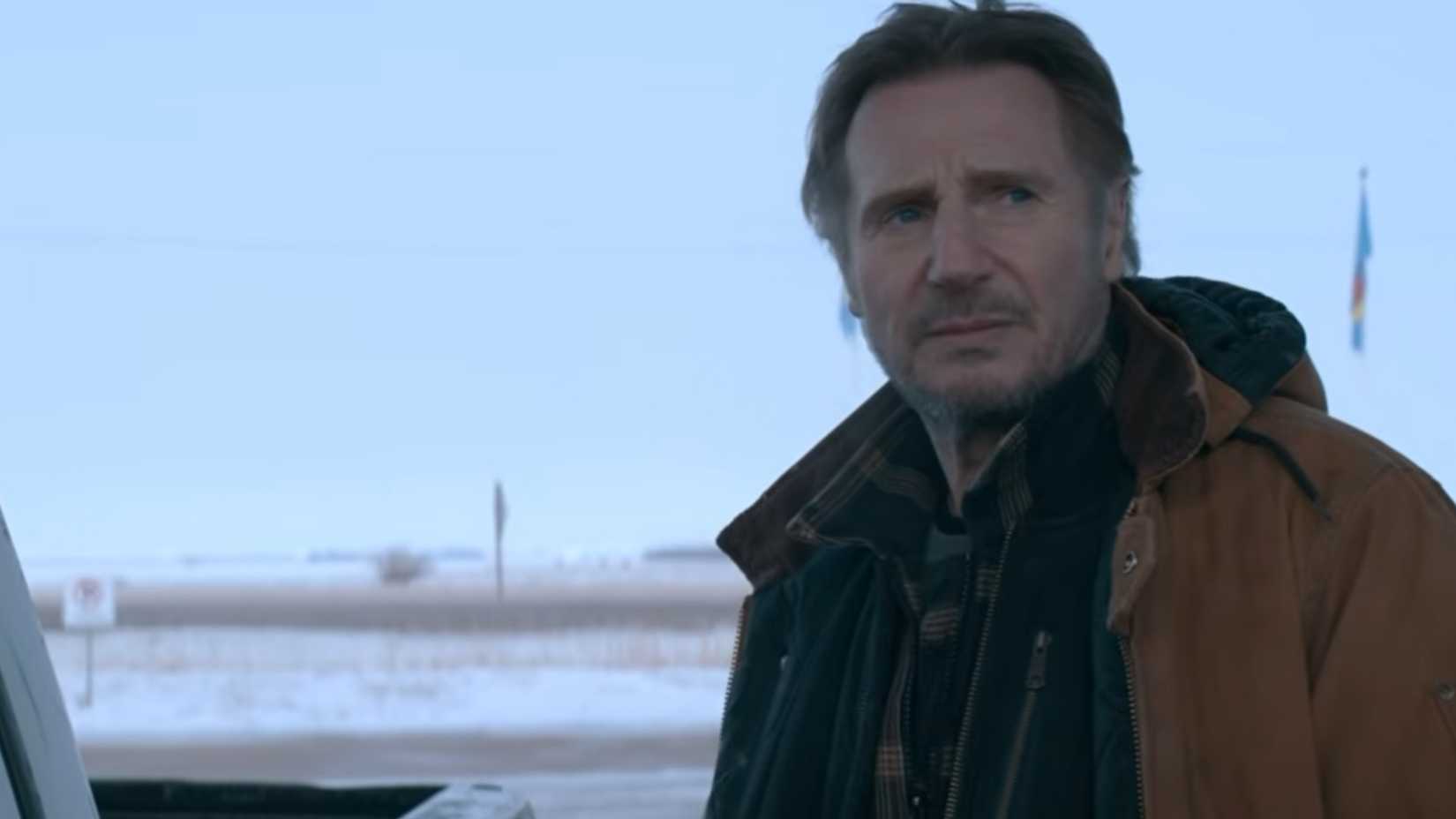 Liam Neeson looking into the distance in the snow in The Ice Road