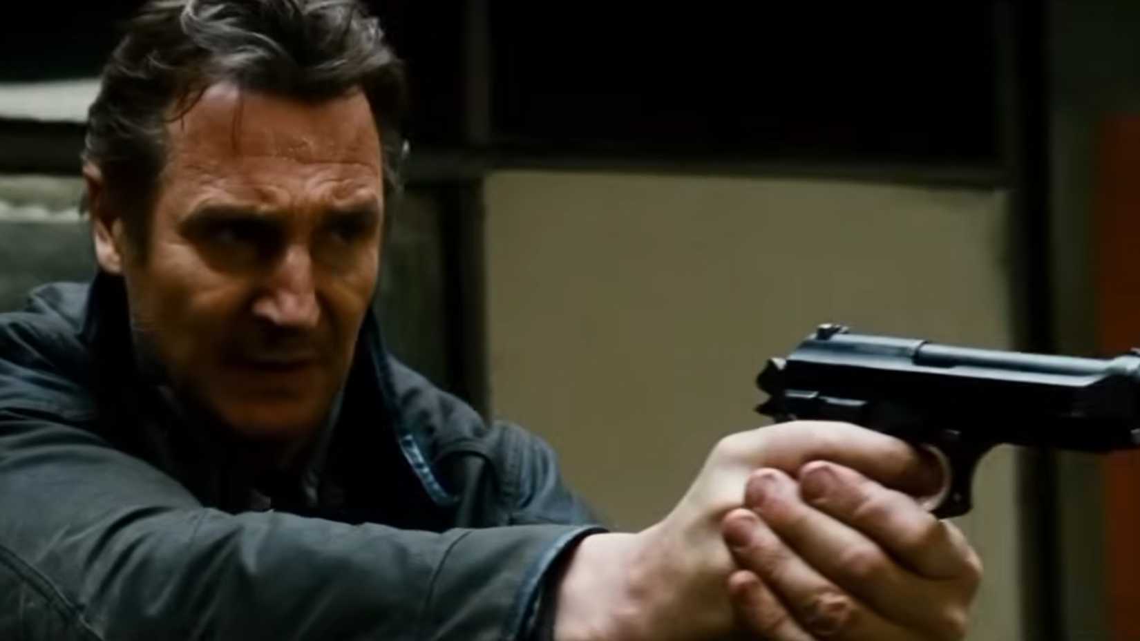 Liam Neeson with a pistol drawn in Taken 2