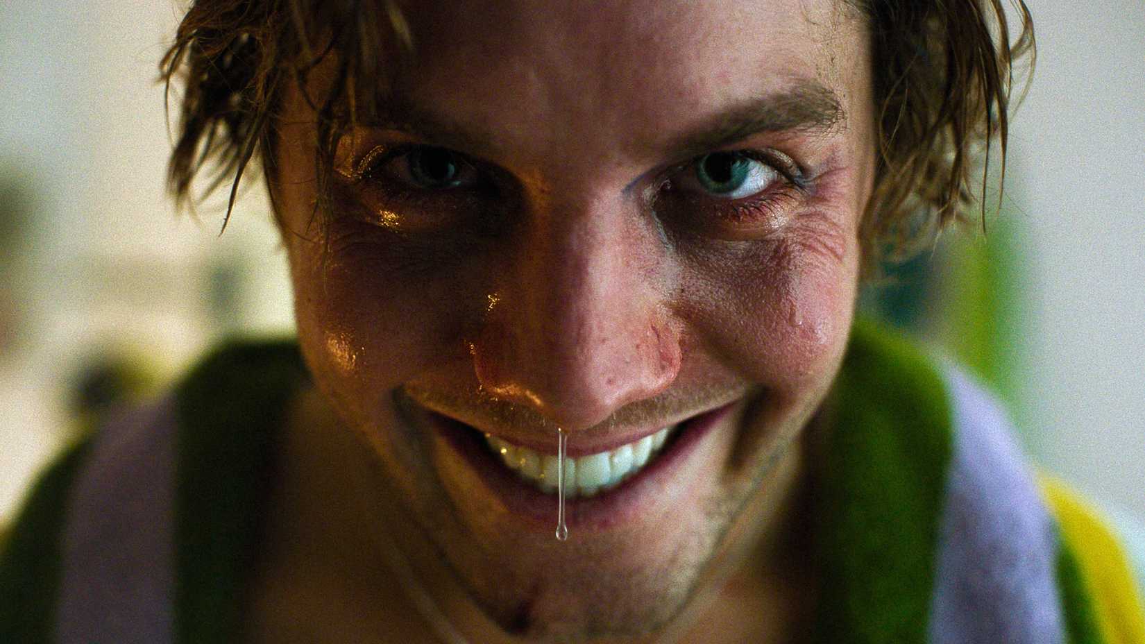 Lukas Gage smiling in Smile 2