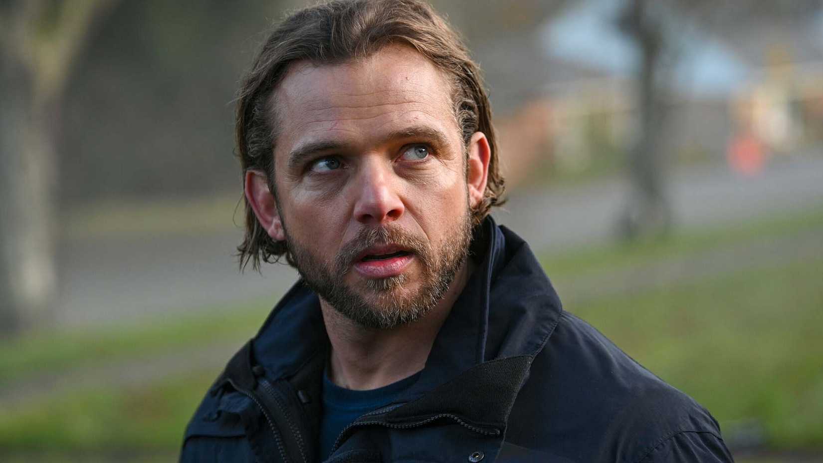 Max Thieriot as Bode Leone looking preoccupied  in Fire Country season 3, episode 16