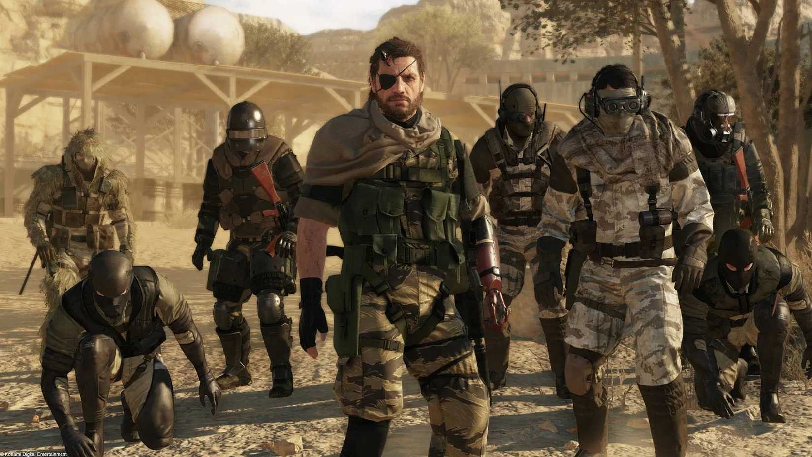 A group of characters standing around Snake in Metal Gear Solid 5.