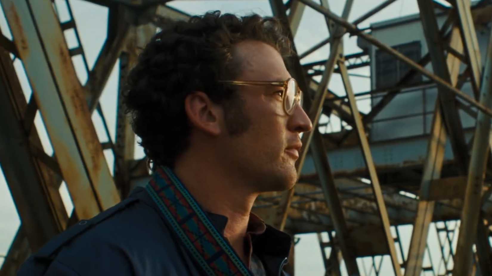 Miles Teller looking at the sun in Paper Tiger