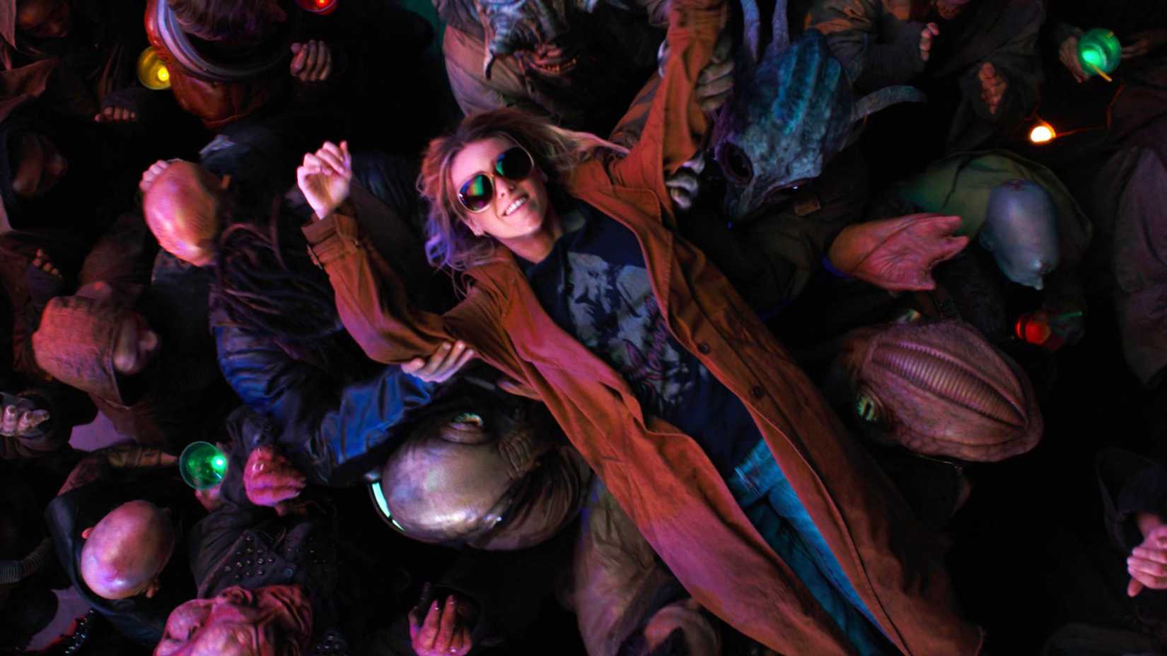 Milly Alcock as Kara Zor-El partying in Supergirl