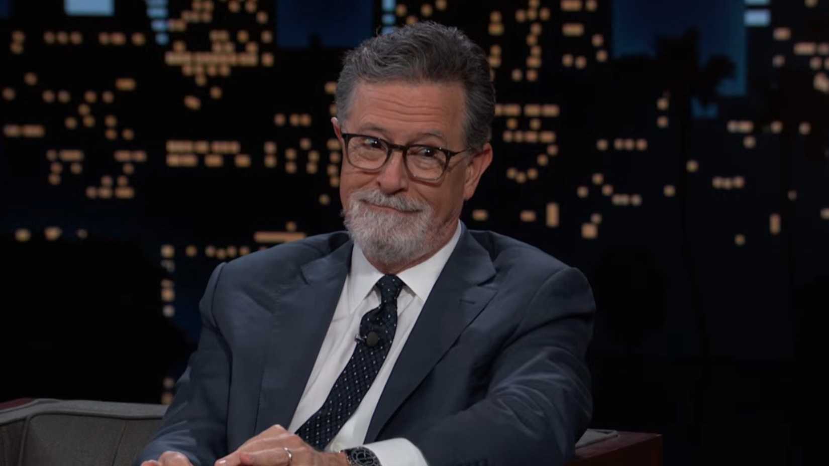 Stephen Colbert smirking on Jimmy Kimmel Live