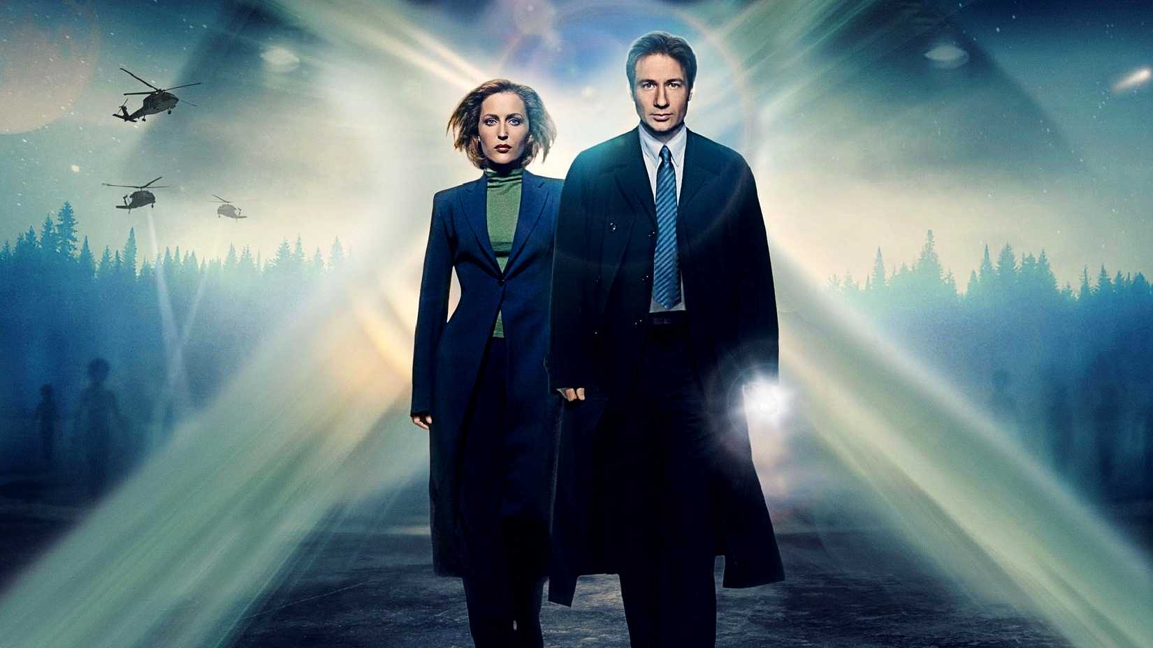 Mulder and Scully walk together in X-Files poster