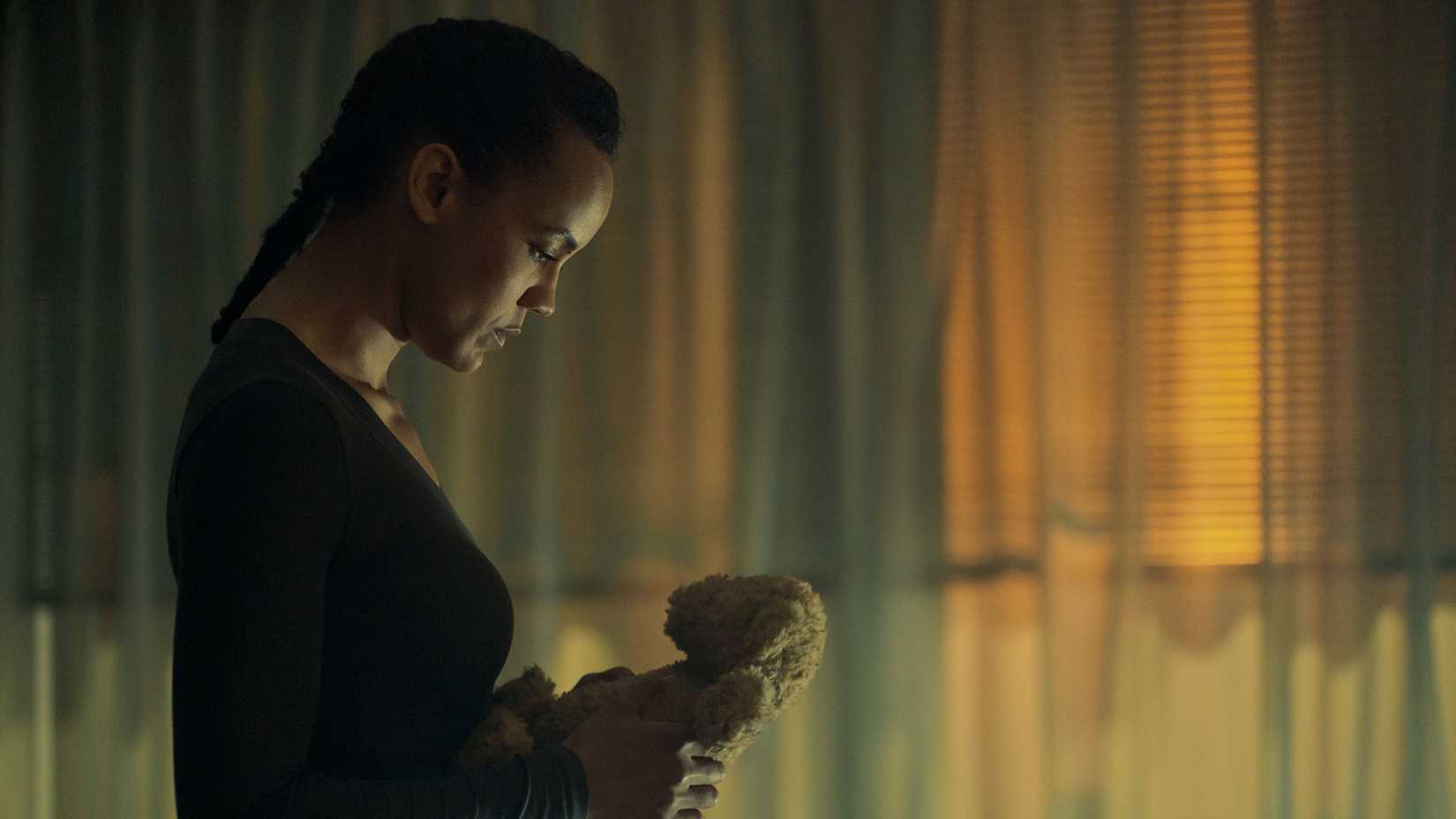 Neagley holding a teddy bear