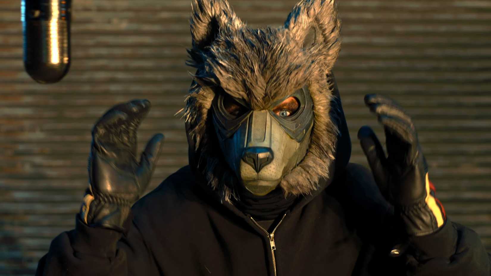 Nicholas Hoult wearing a wolf mask in How to Rob a Bank