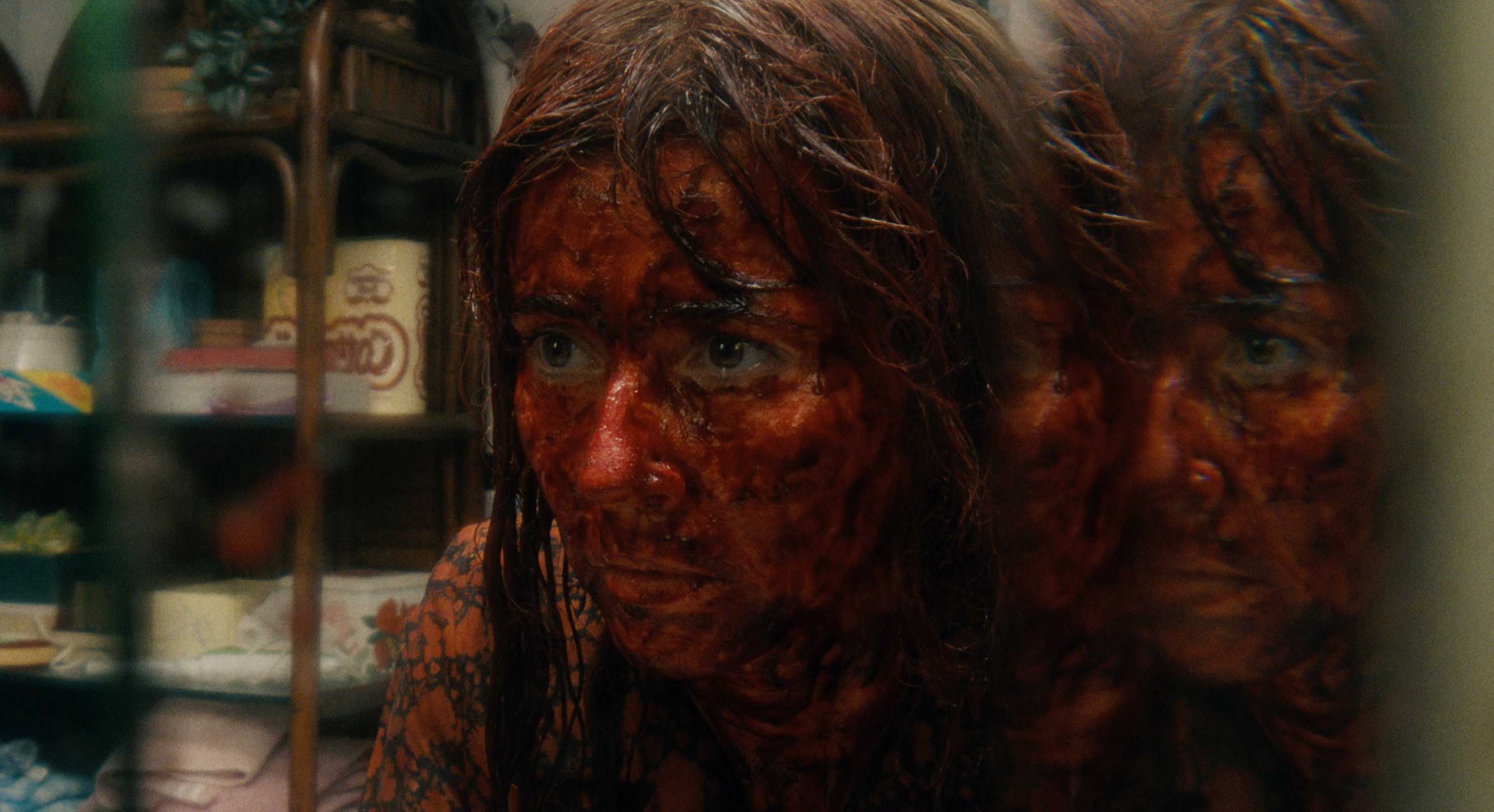 Pam covered in blood in Crystal Lake trailer.