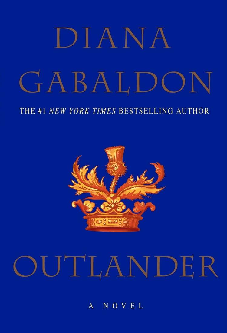 Outlander book cover shows a golden crown against a blue backdrop