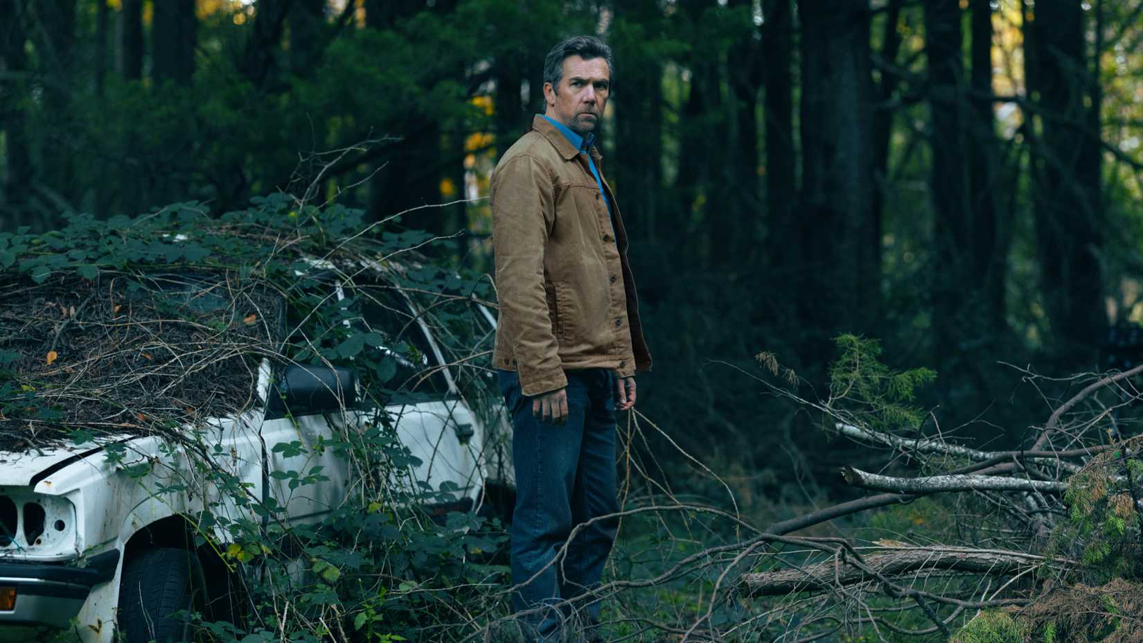 Patrick Brammall standing in the woods in Last Seen