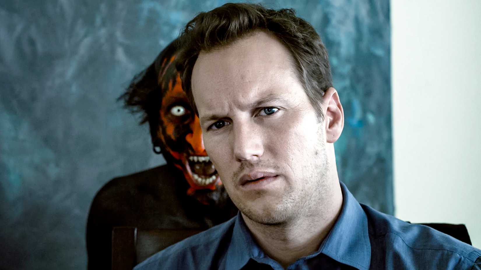 Patrick Wilson as John Lambert seeing a demon in a mirror behind him in Insidious (2010)