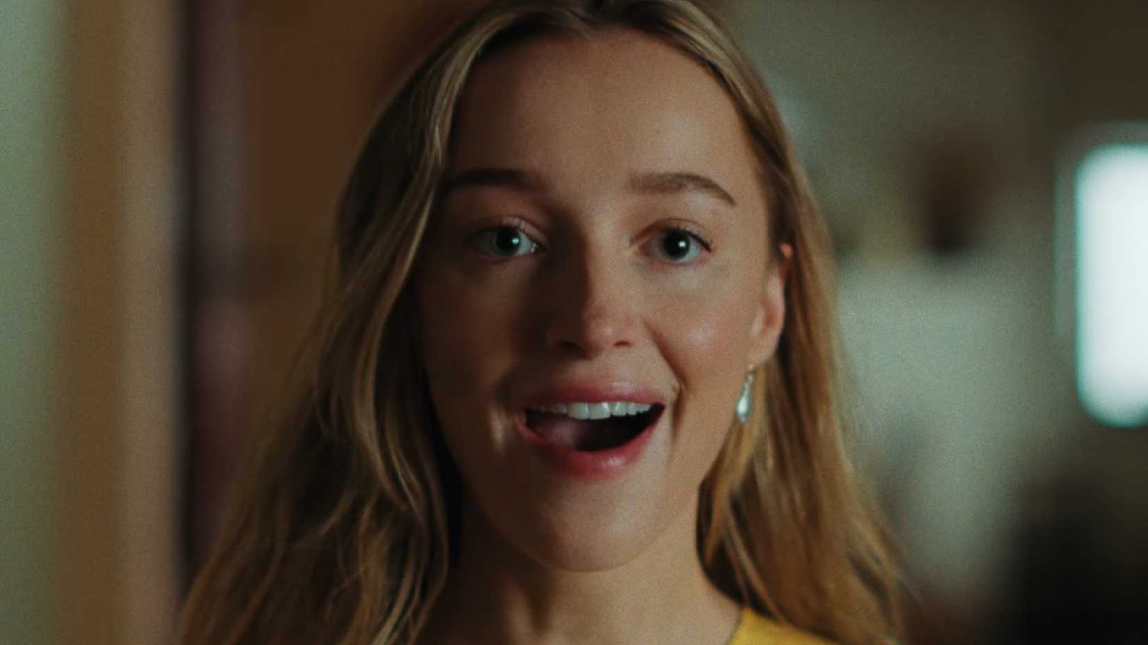 Phoebe Dynevor looking happy in Remain