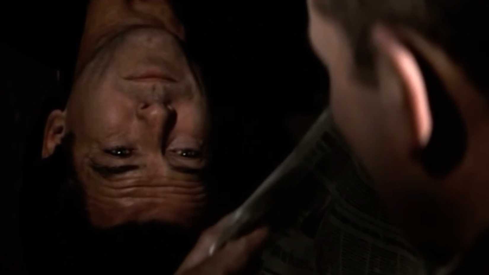 Pierce Brosnan as 007 about to knock a guard out in goldeneye