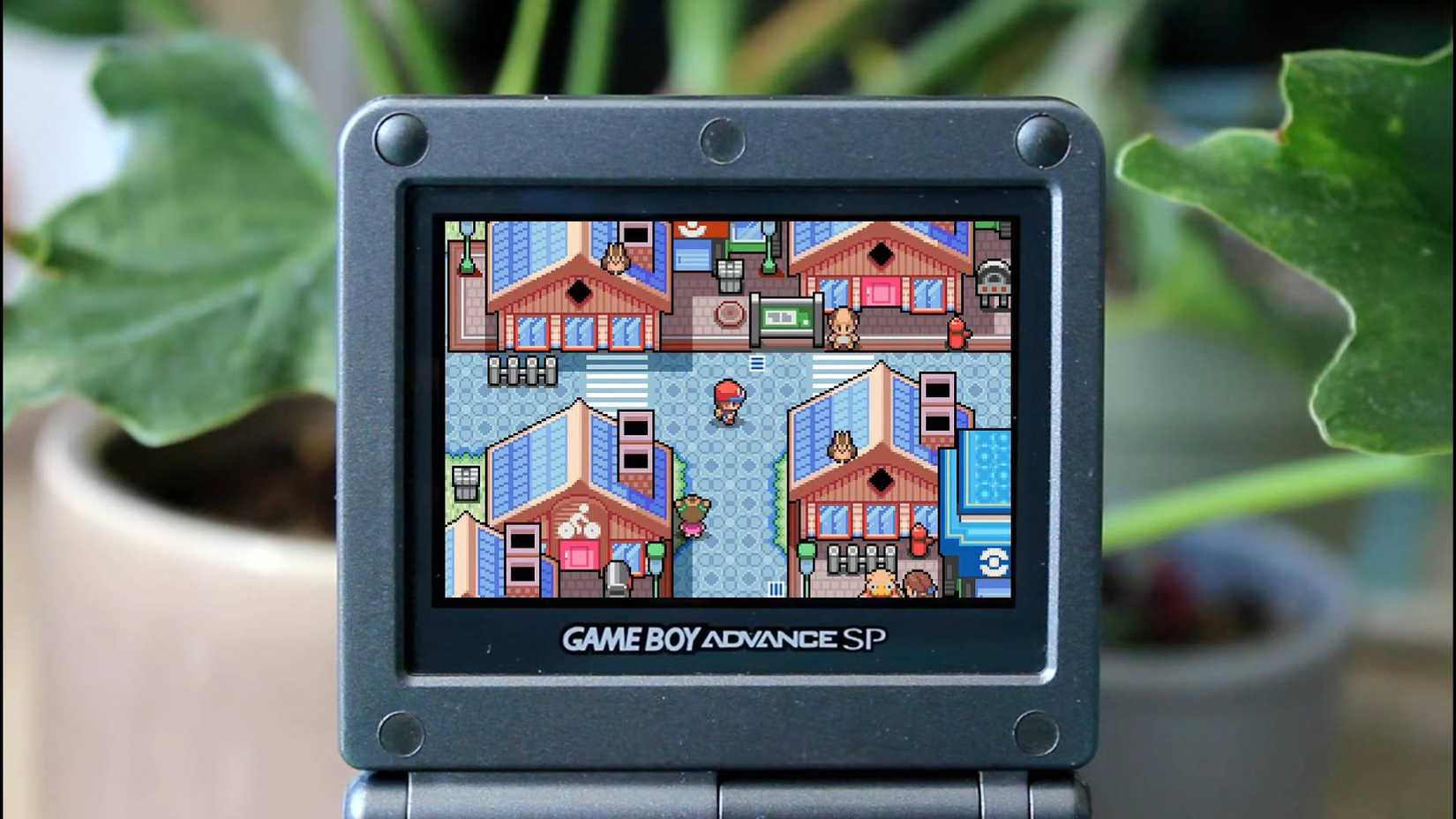 Gameplay of the player walking around a town in Pokemon WaterBlue on a Game Boy Advance SP.