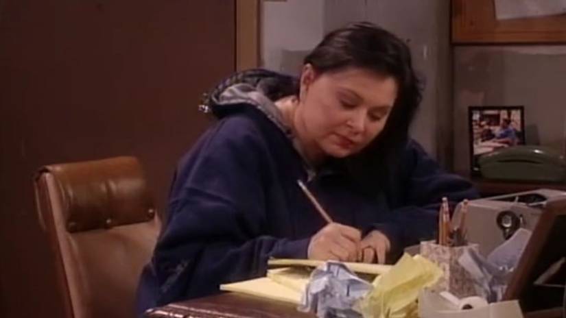Roseanne writing her memoirs in the Roseanne season 9 finale.