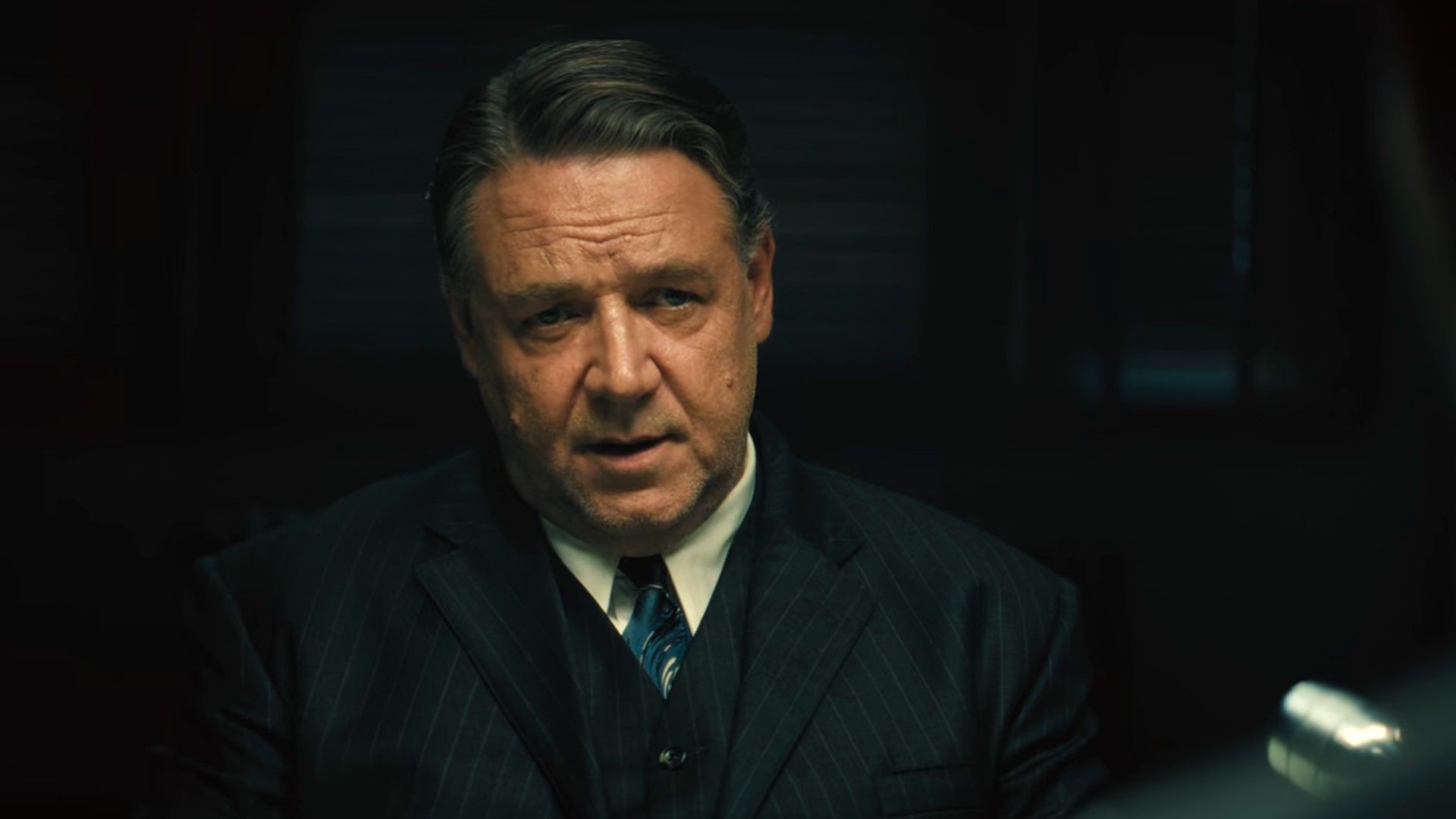 Russell Crowe looks a Jacob Tremblay in an interview in Unabomber