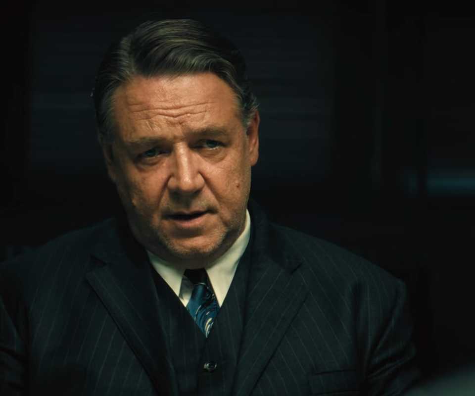 Russell Crowe looks a Jacob Tremblay in an interview in Unabomber