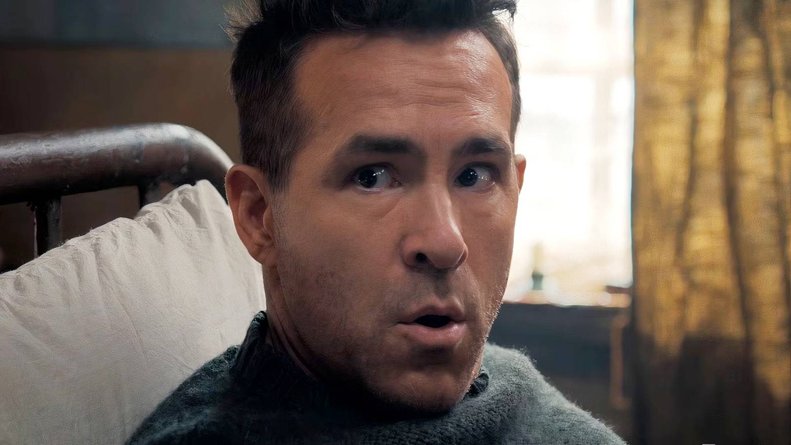 Ryan Reynolds with his mouth open in Mayday