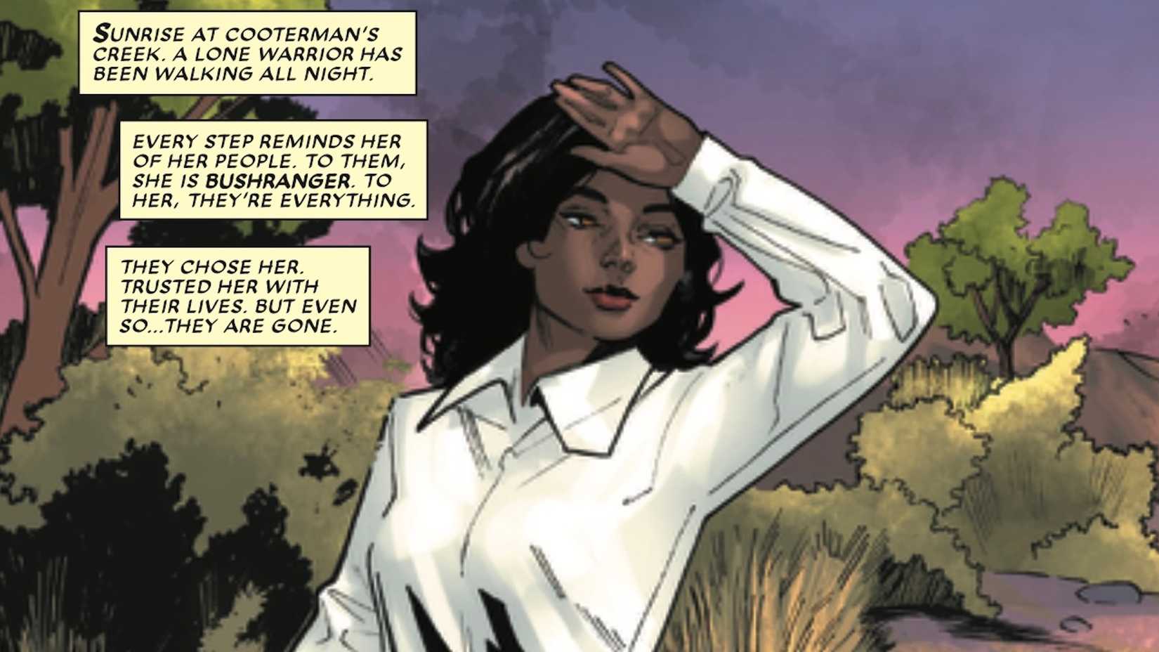 Bushranger in the Australian wilderness in a white-collared shirt and using her hand to block sunlight from hitting her eyes
