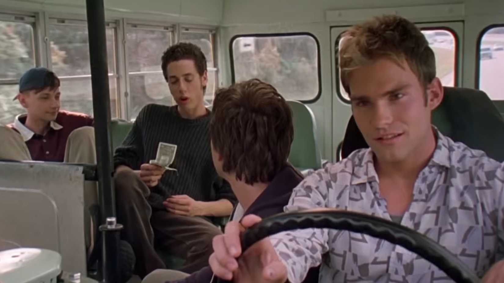 Seann William Scott driving a bus with his friends in Road Trip