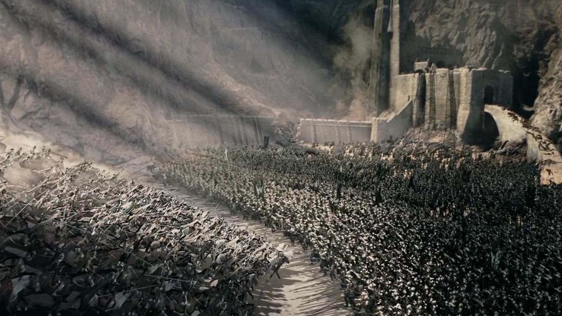 Soldiers clash at helms deep as the sun rises in lord of the rings the two towers