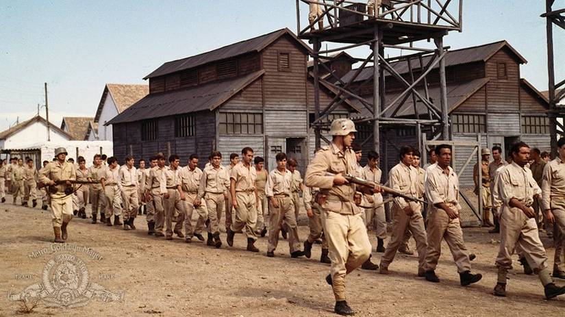 Soldiers marching prisoners through a camp in The Rat Patrol