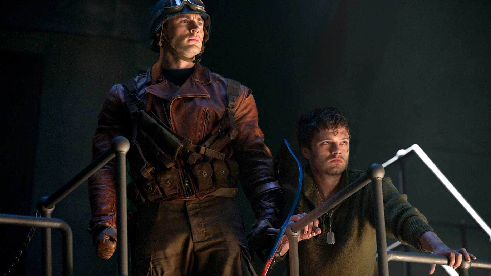Steve Roger and Bucky Barnes stand together in Captain America The First Avenger