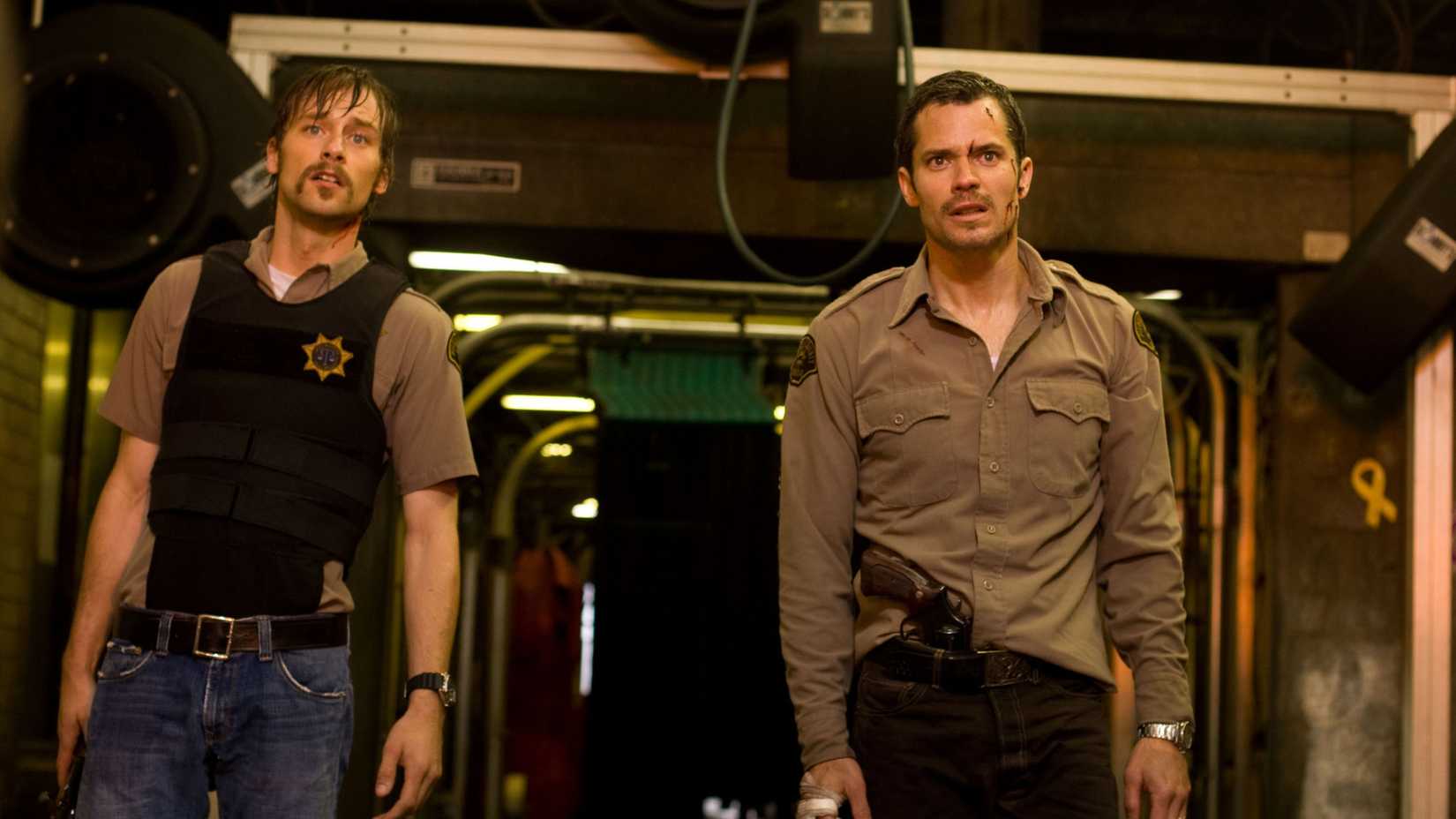 Joe Anderson and Timothy Olyphant looking shocked in The Crazies (2010)