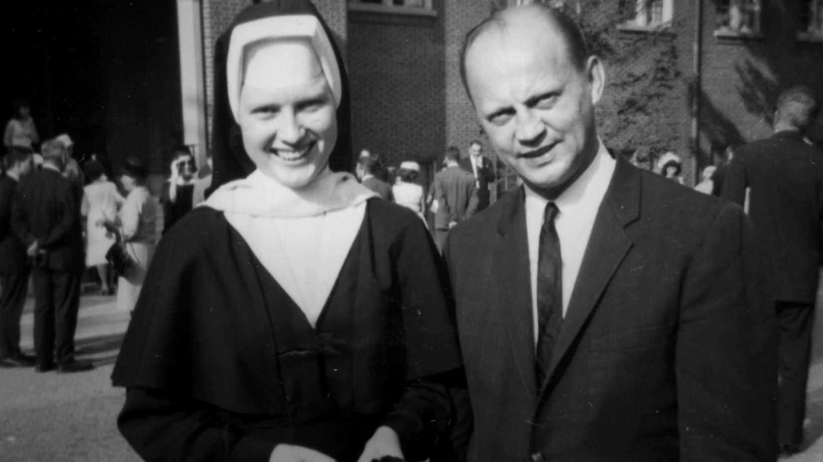 A black and white photo of a nun and a man in a suit in the Netflix documentary The Keepers.