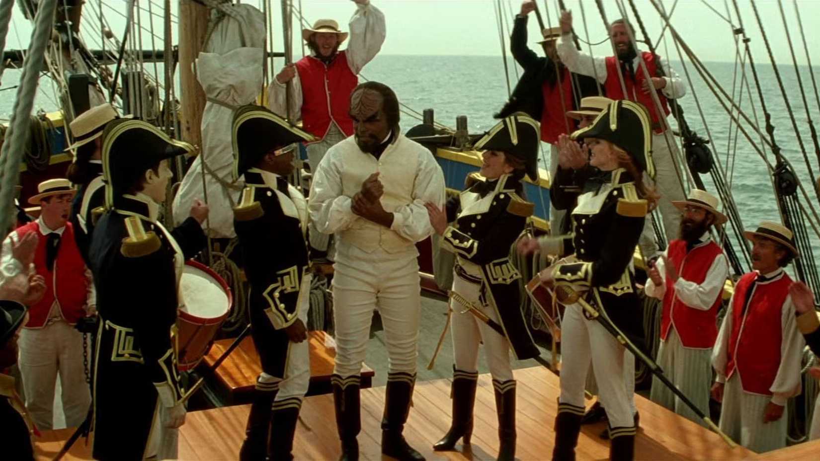 The USS Enterprise-D bridge crew and several holographic crew members on the 19th century Enterprise sailing ship in Star Trek Generations