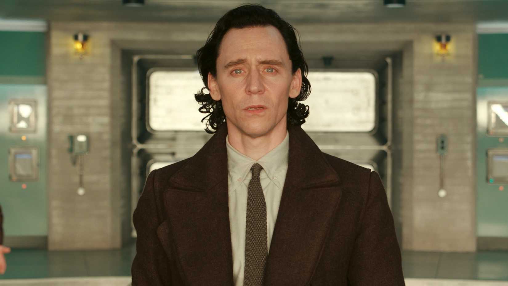 Tom Hiddleston as Loki looking straight ahead with concern in Loki