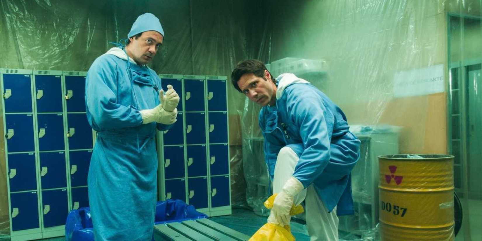 Two men in decontamination suits in Radioactive Emergency on Netflix