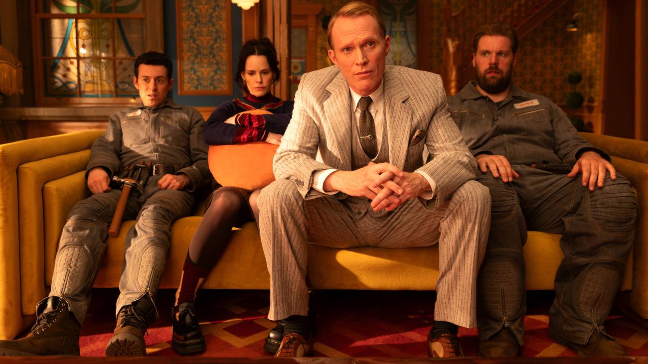 Paul Bettany, Emily Hampshire, Henry Lewis, and Jonathan Sayer sitting on a couch in VisionQuest