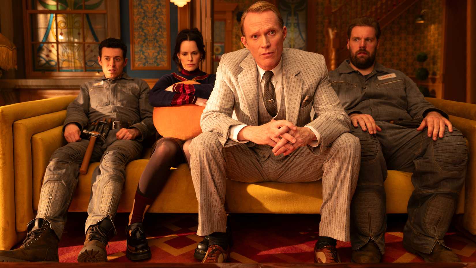 Paul Bettany, Emily Hampshire, Henry Lewis, and Jonathan Sayer sitting on a couch in VisionQuest