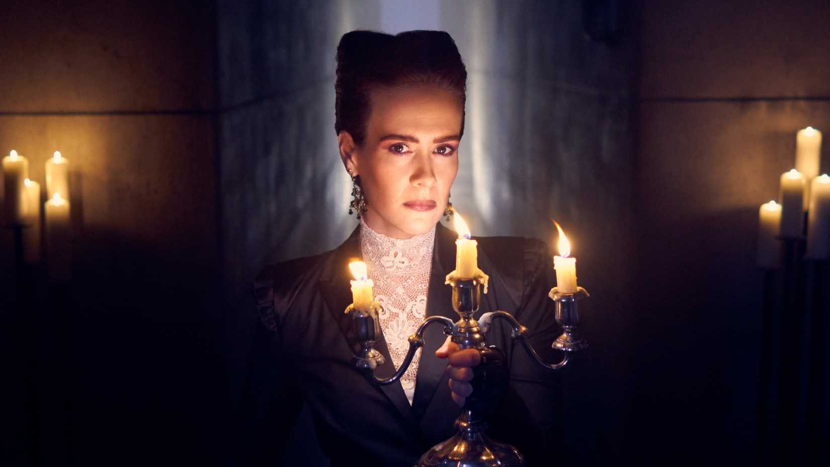 Wilhelmina Venable holds a candelabra in American Horror Story season 8