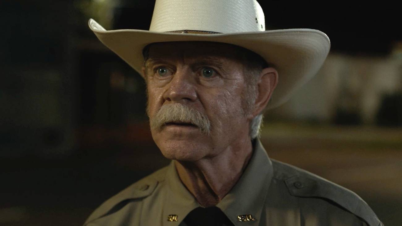 William H Macy in a white cowboy hat in The Deputy