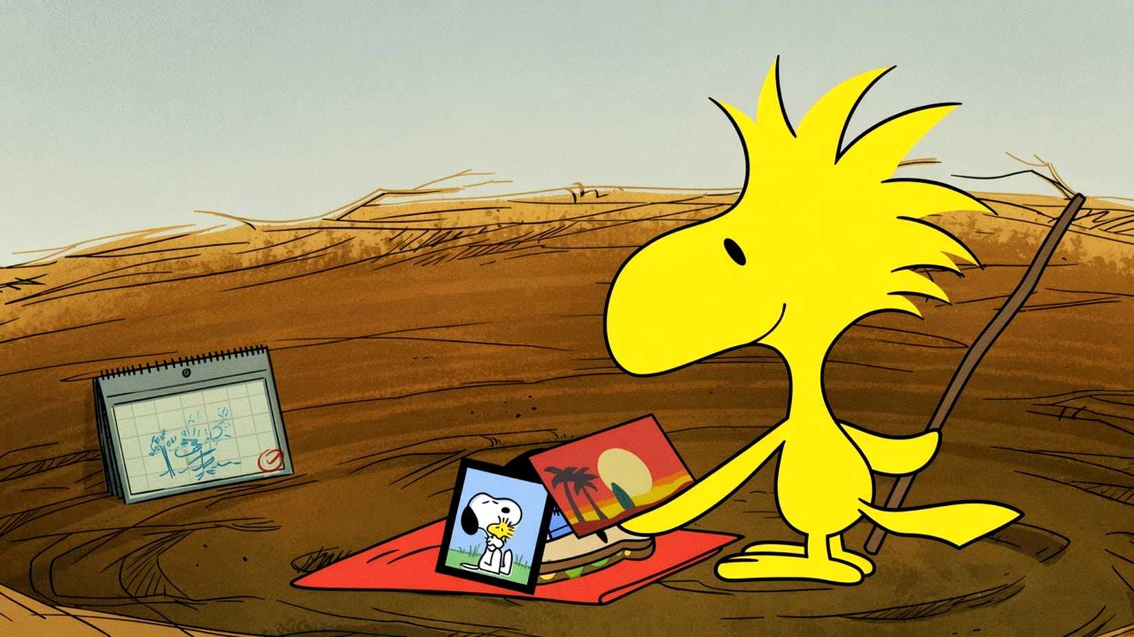 Woodstock looks at his photos in Peanuts' The Snoopy Show